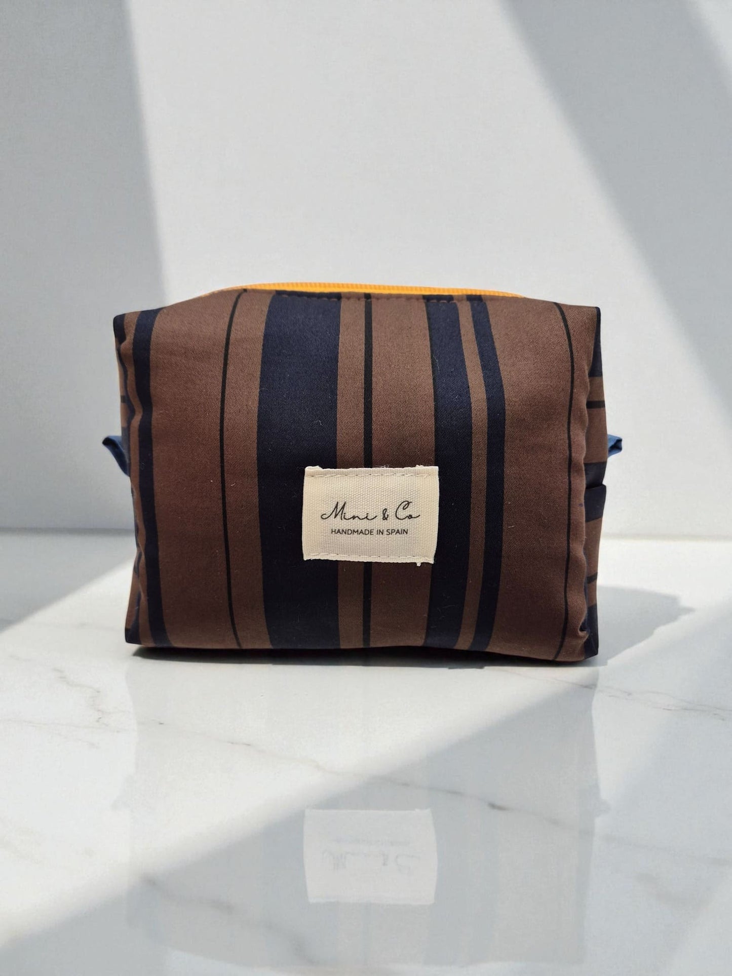 Neceser pequeño chocolate y marino